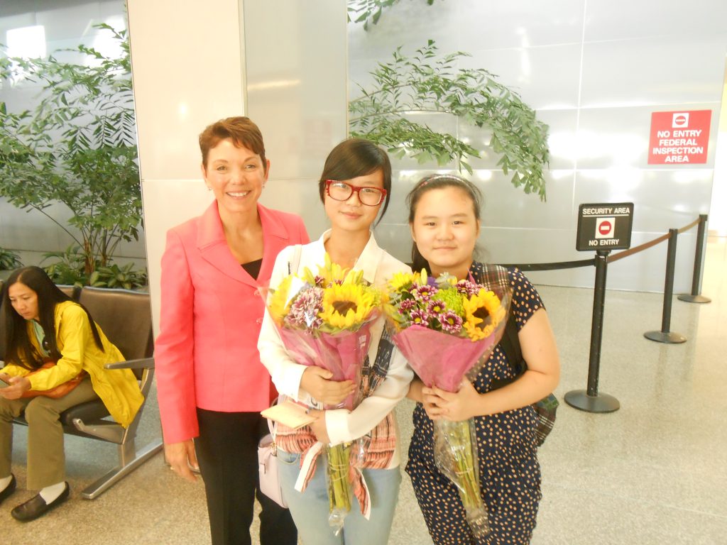 Littlejohn greets Anni and Ruli Zhang at the San Francisco Airport on September 7, 2013.