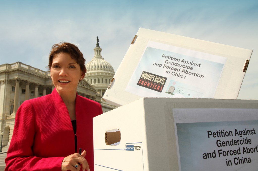 Littlejohn at a Congressional press conference, with 200,000 signatures on a petition to end gendercide and forced abortion in China. Littlejohn and Cong. Chris Smith attempted to deliver these to the Chinese Embassy on April 24, 2013, but the Chinese Embassy refused to open its doors.